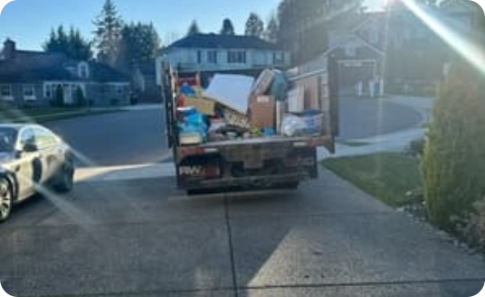 Loaded junk removal truck on Seattle residential street
